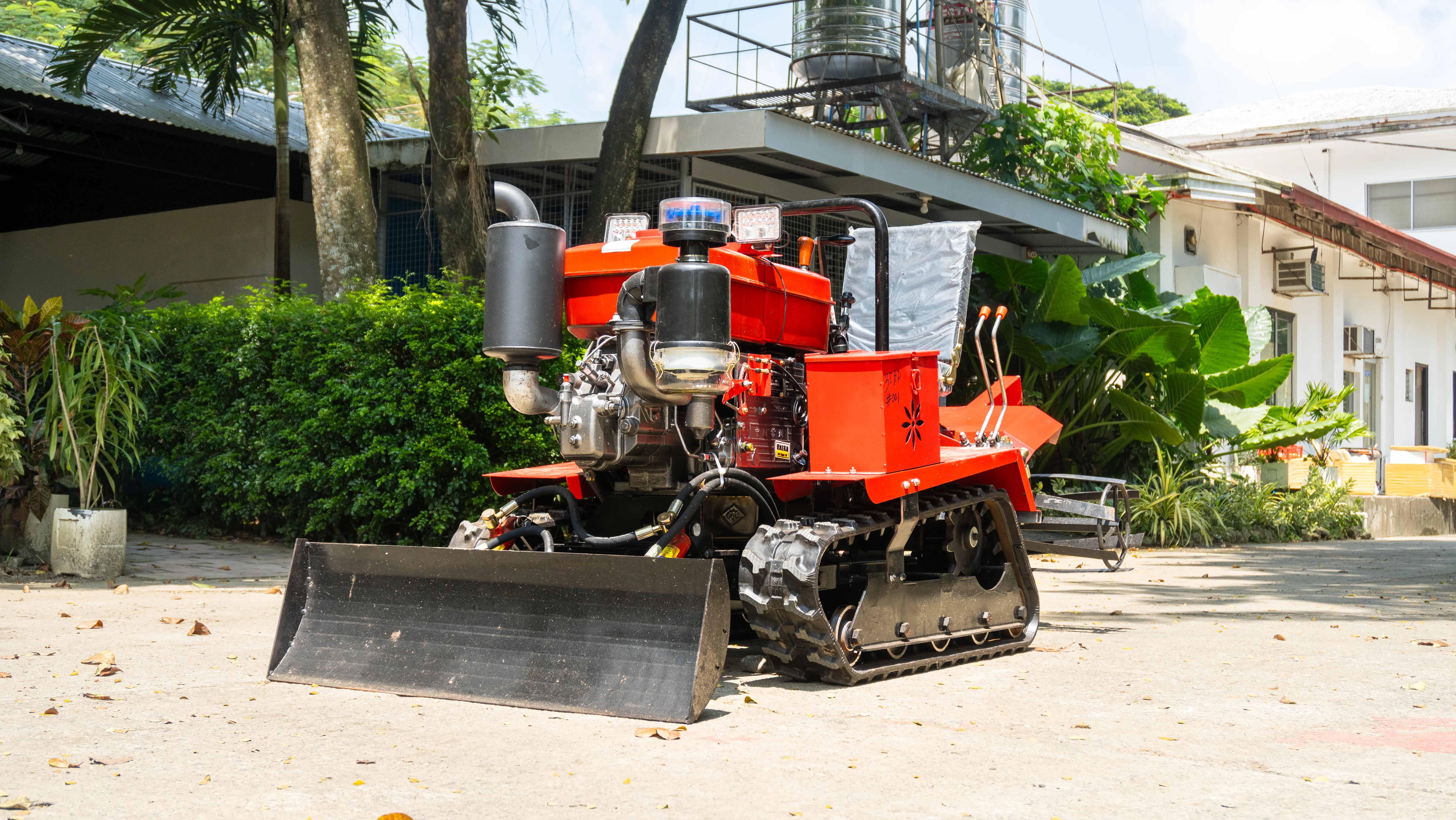 ADiNSO compact red utility tractor for orchard and greenhouse operations