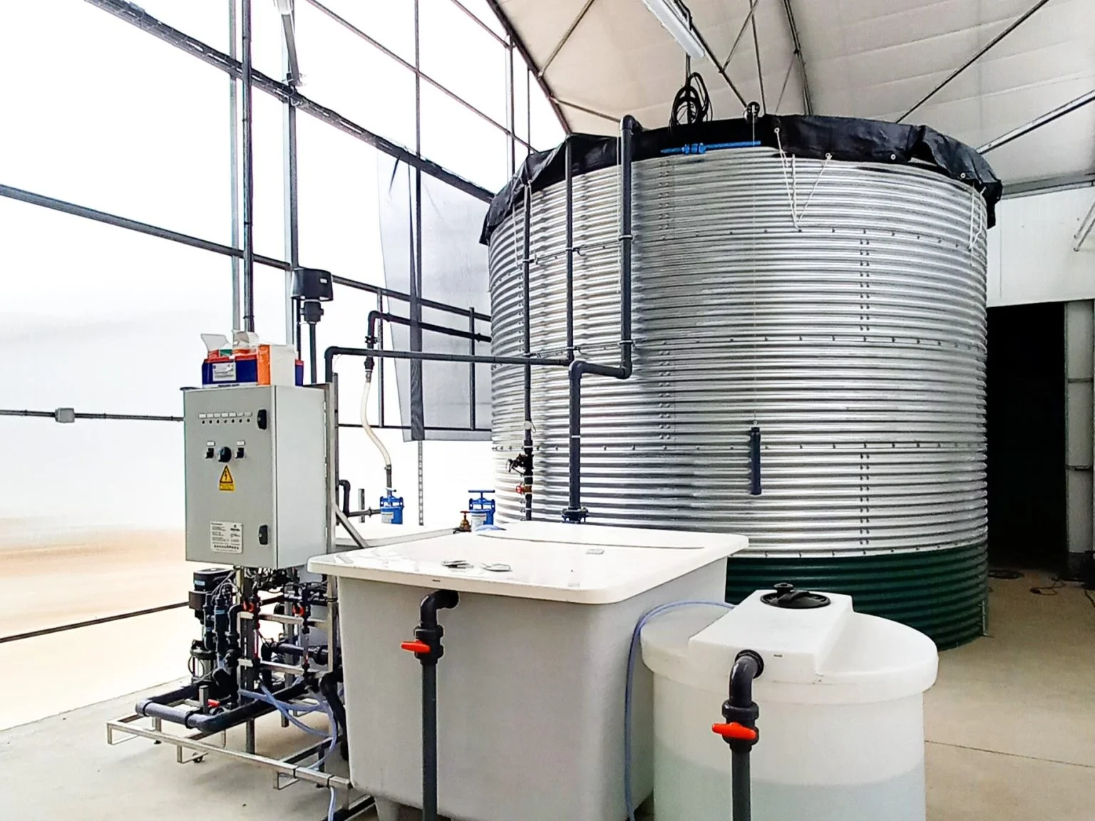 Modular Dutch galvanized steel water silo assembly in progress